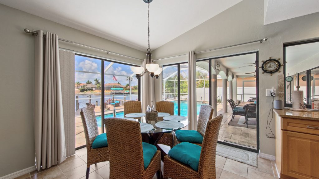 Florida rental dining room looking out to pool