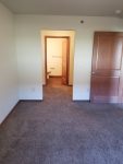 Town Square Residential Suites bedroom looking into closet and bathroom