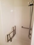 Town Square Residential Suites walk in shower with fold down seat